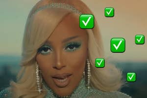 Doja Cat is posing in a music video with check marks surrounding her