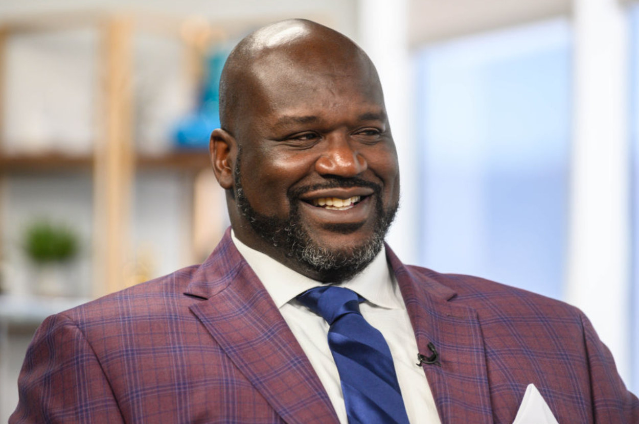 Shaquille O&#x27;Neal smiling in a suit