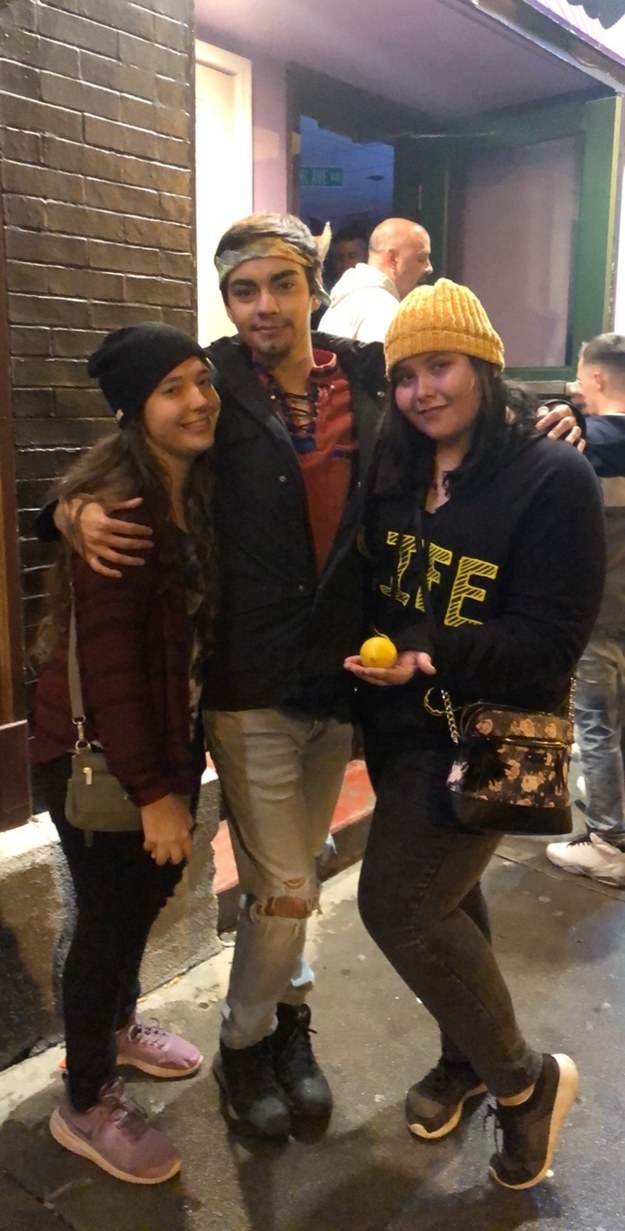 Someone wearing a shirt that says "life" and holding a lemon