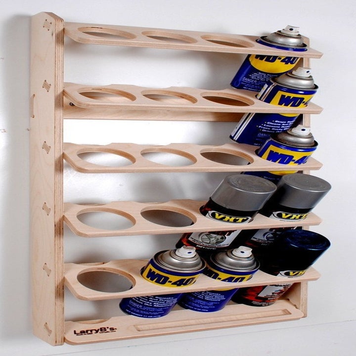 wall mount shelf with slots for spray paint cans