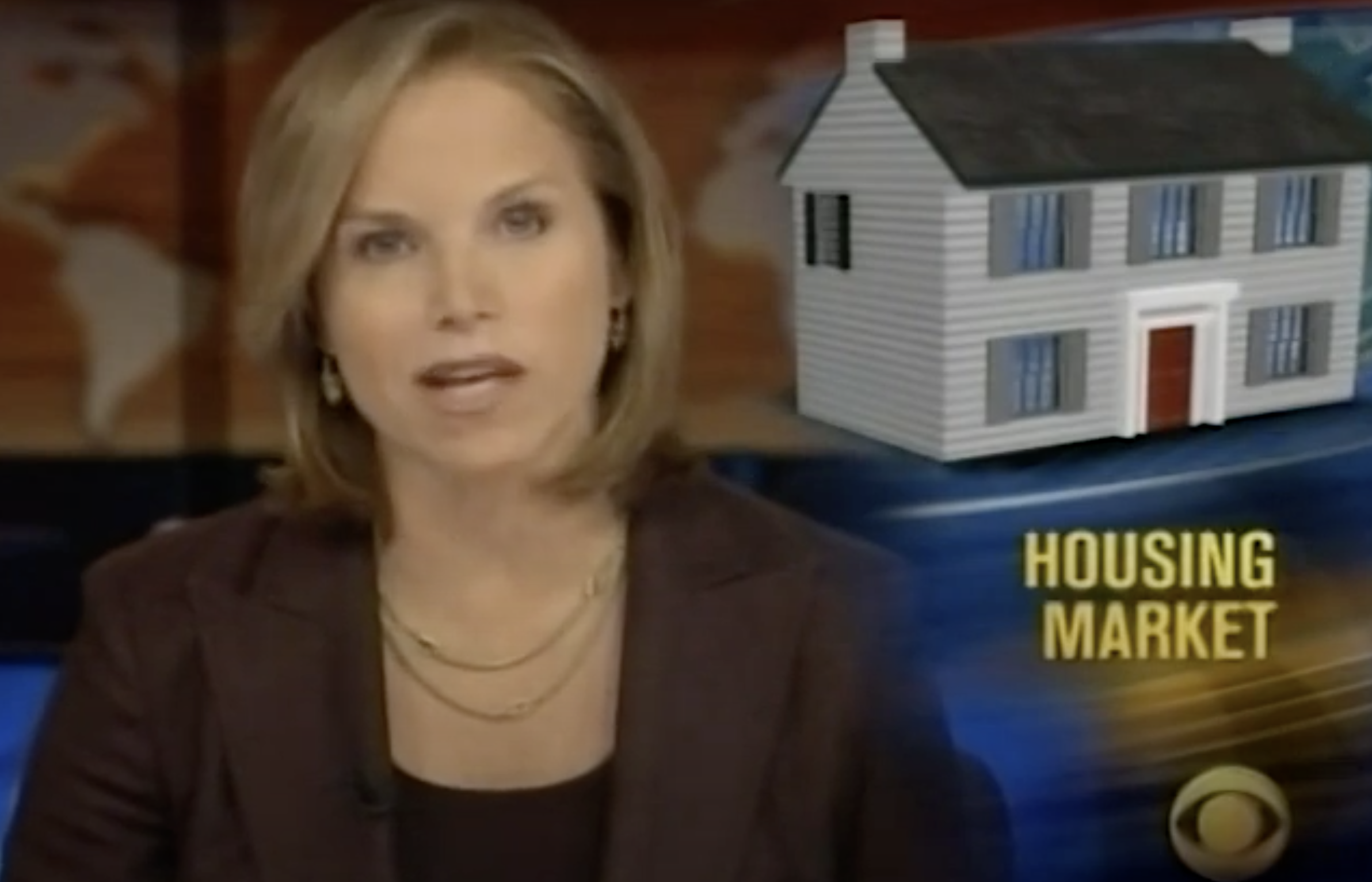 Katie Couric reading the evening news on a CBS broadcast