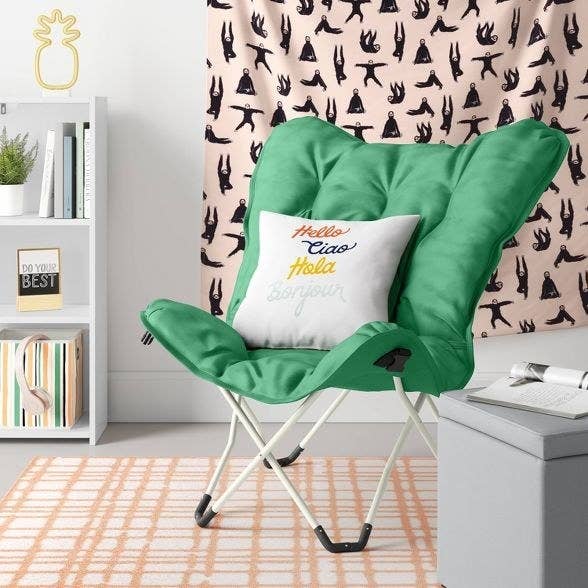 green chair with white pillow