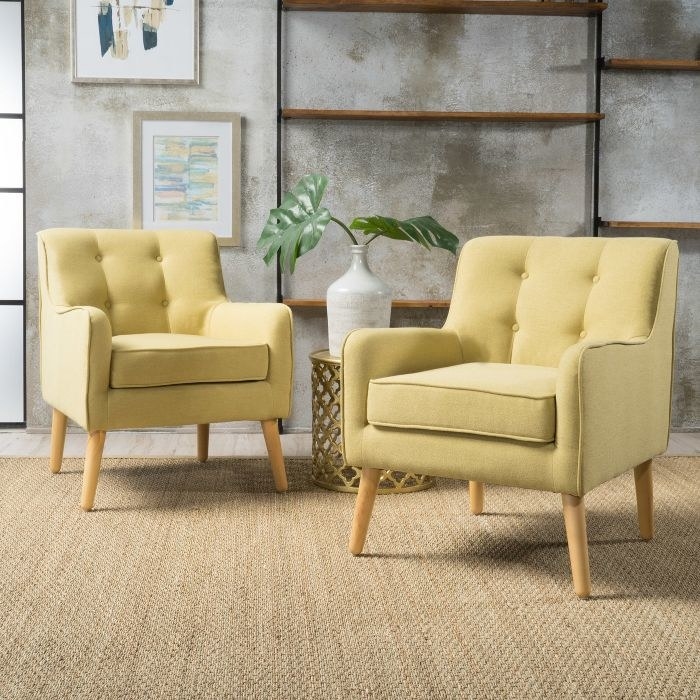 two yellow fabric chairs