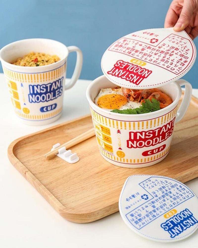 A ceramic mug filled with ramen noodles