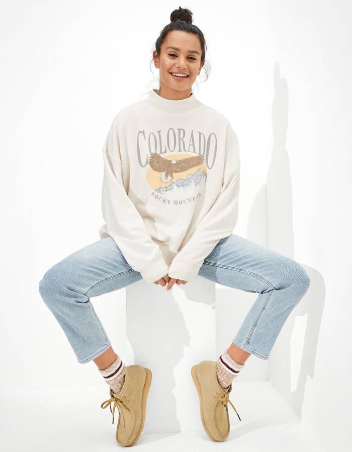 A model wearing a Colorado sweatshirt