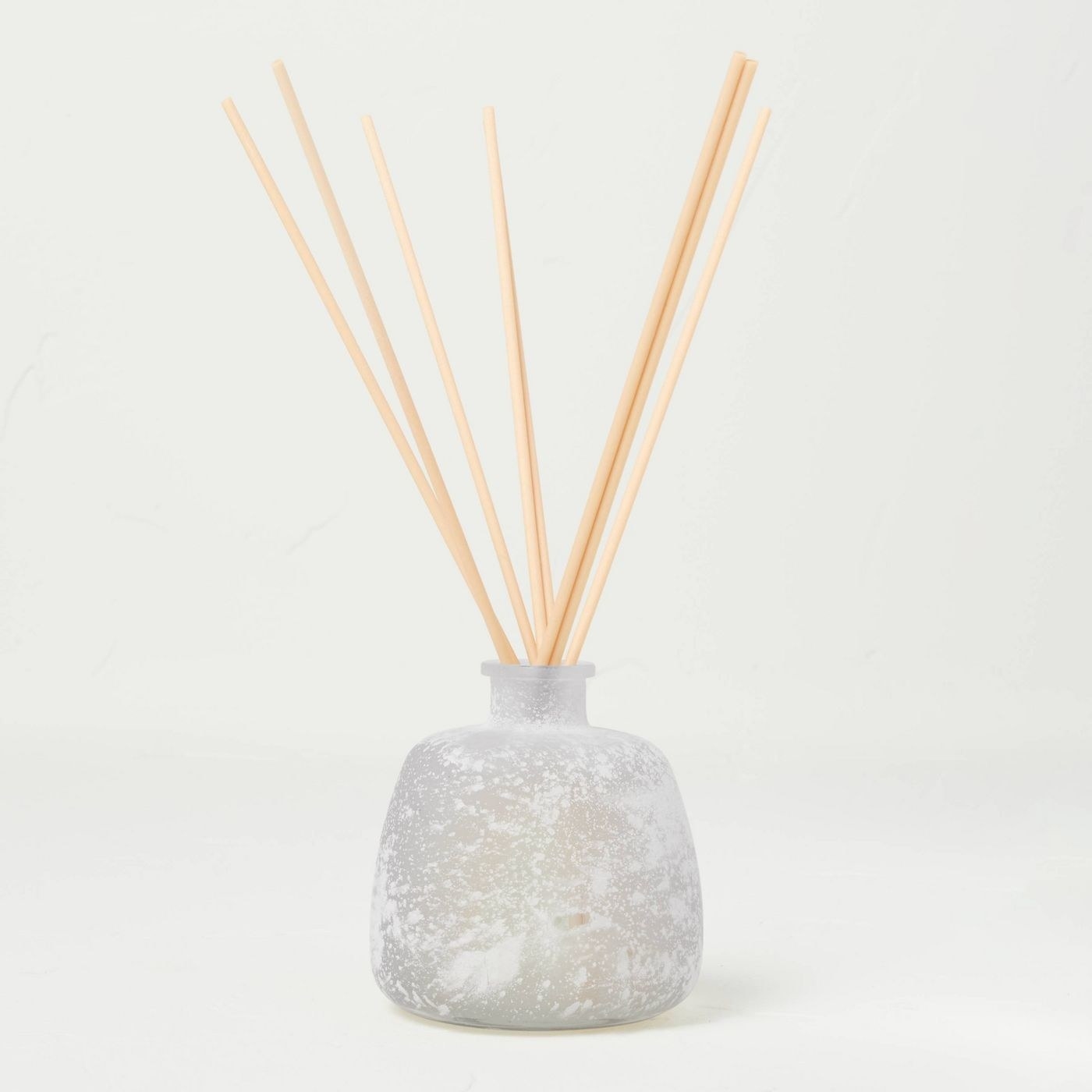 white essential oil diffuser with reeds inside
