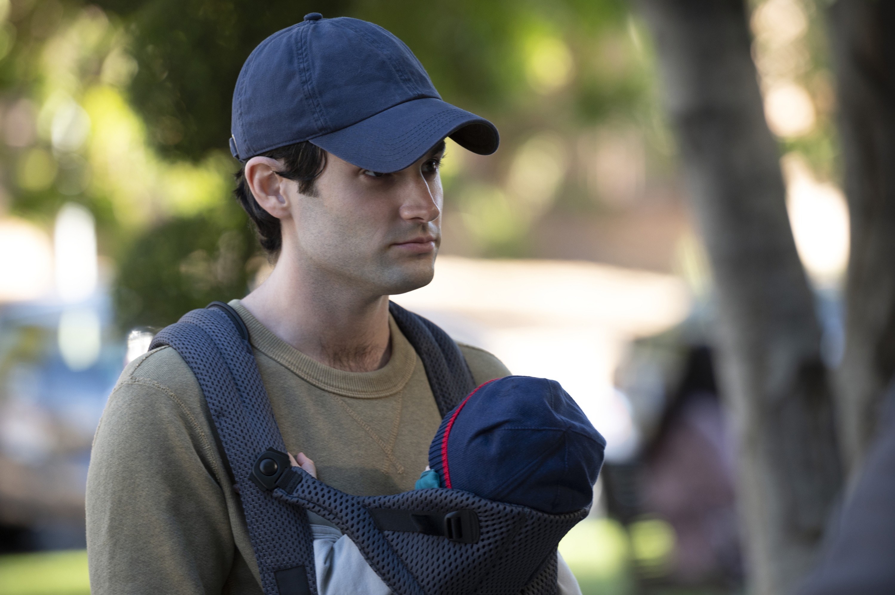 Joe with his baby and hat on You