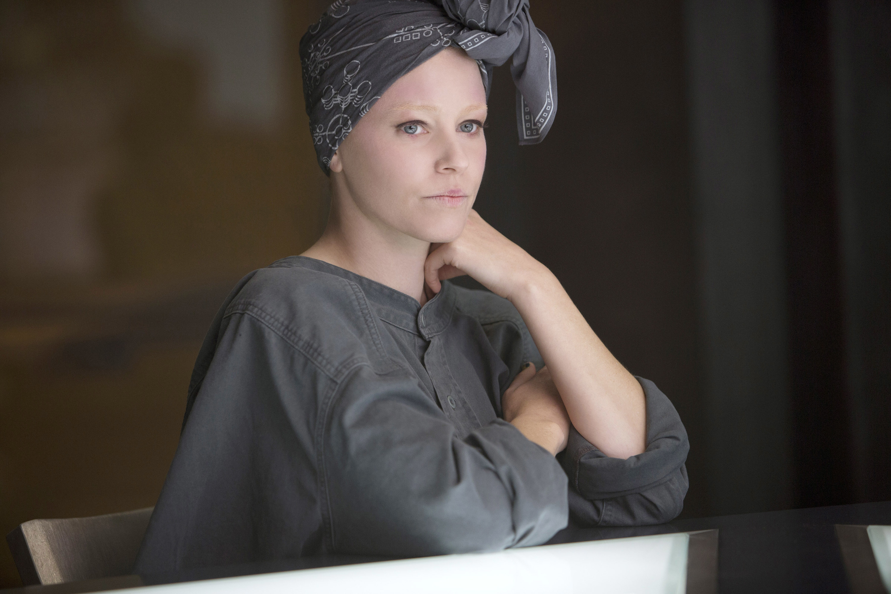 Effie dressed in customized rebel clothing in Mockingjay