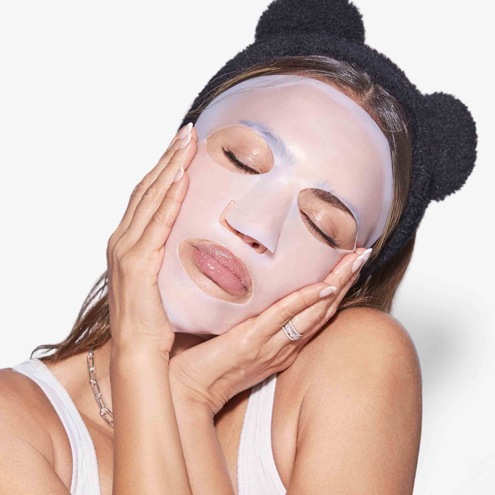 A model is shown wearing the sheet mask