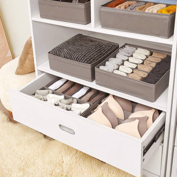 different organizers styled in a dresser with different types of undergarments and socks