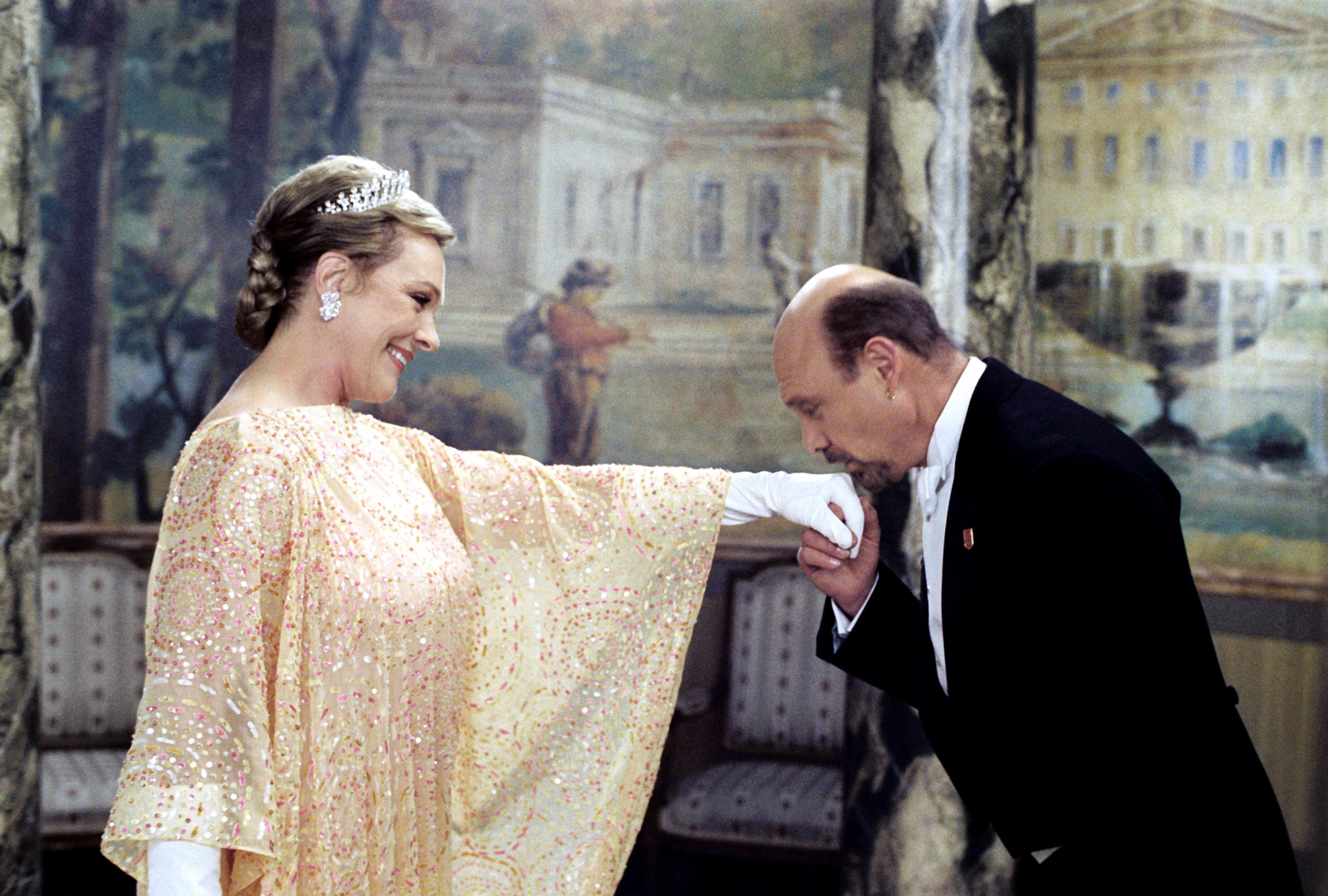 Julie Andrews as the Queen gets her hand kissed by her head of security