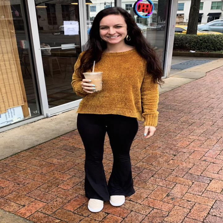 reviewer wearing the black pants