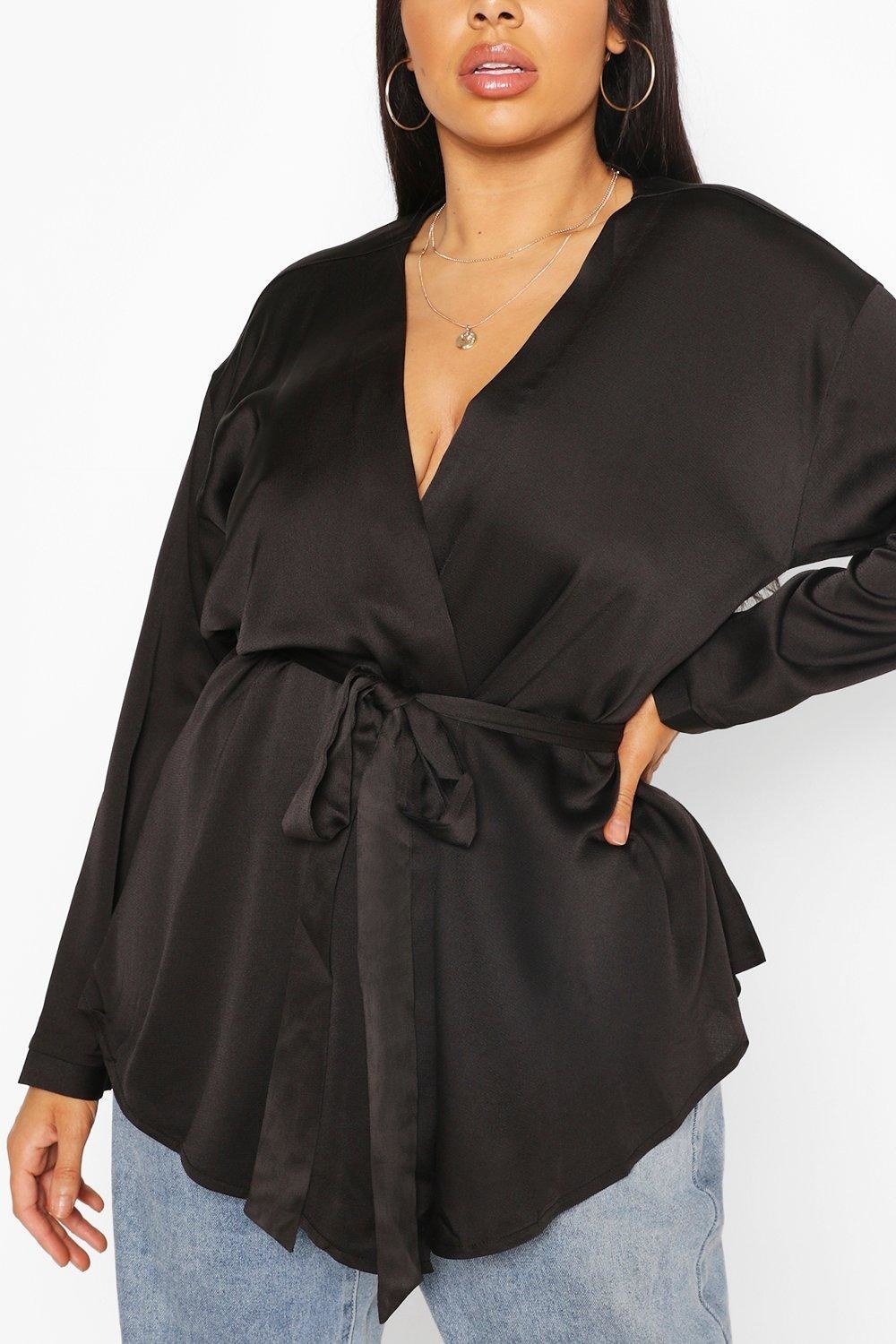 The long-sleeve satin top tied loosely on a model