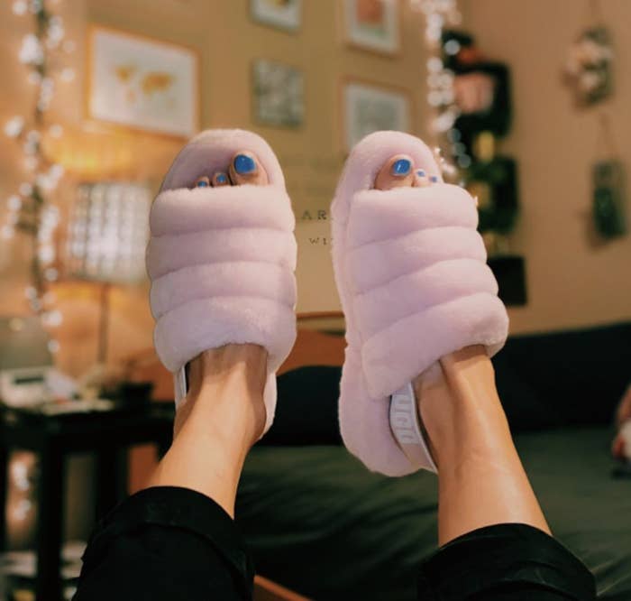 a person wearing the slippers in light pink
