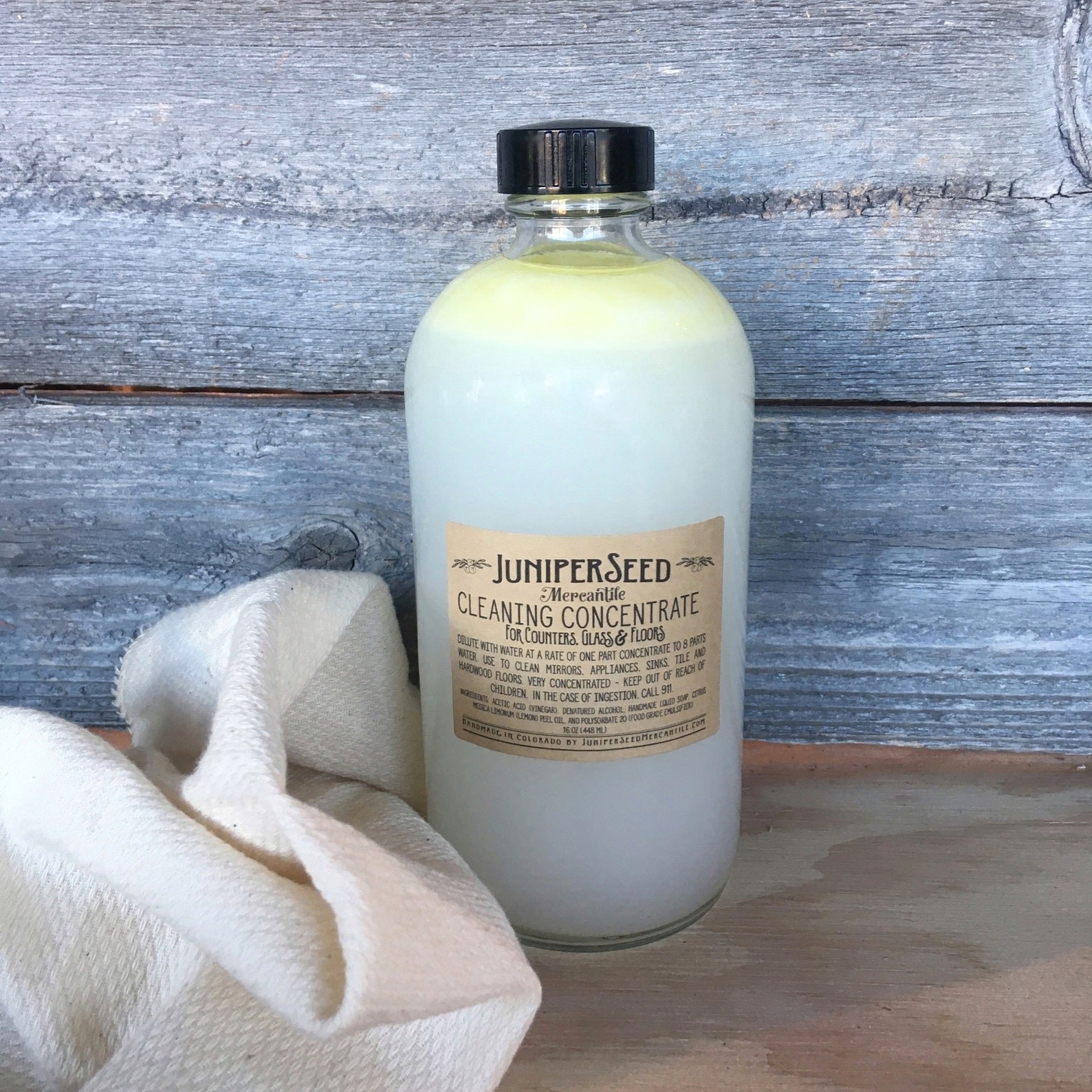 glass bottle of juniper seed cleaning concentrate