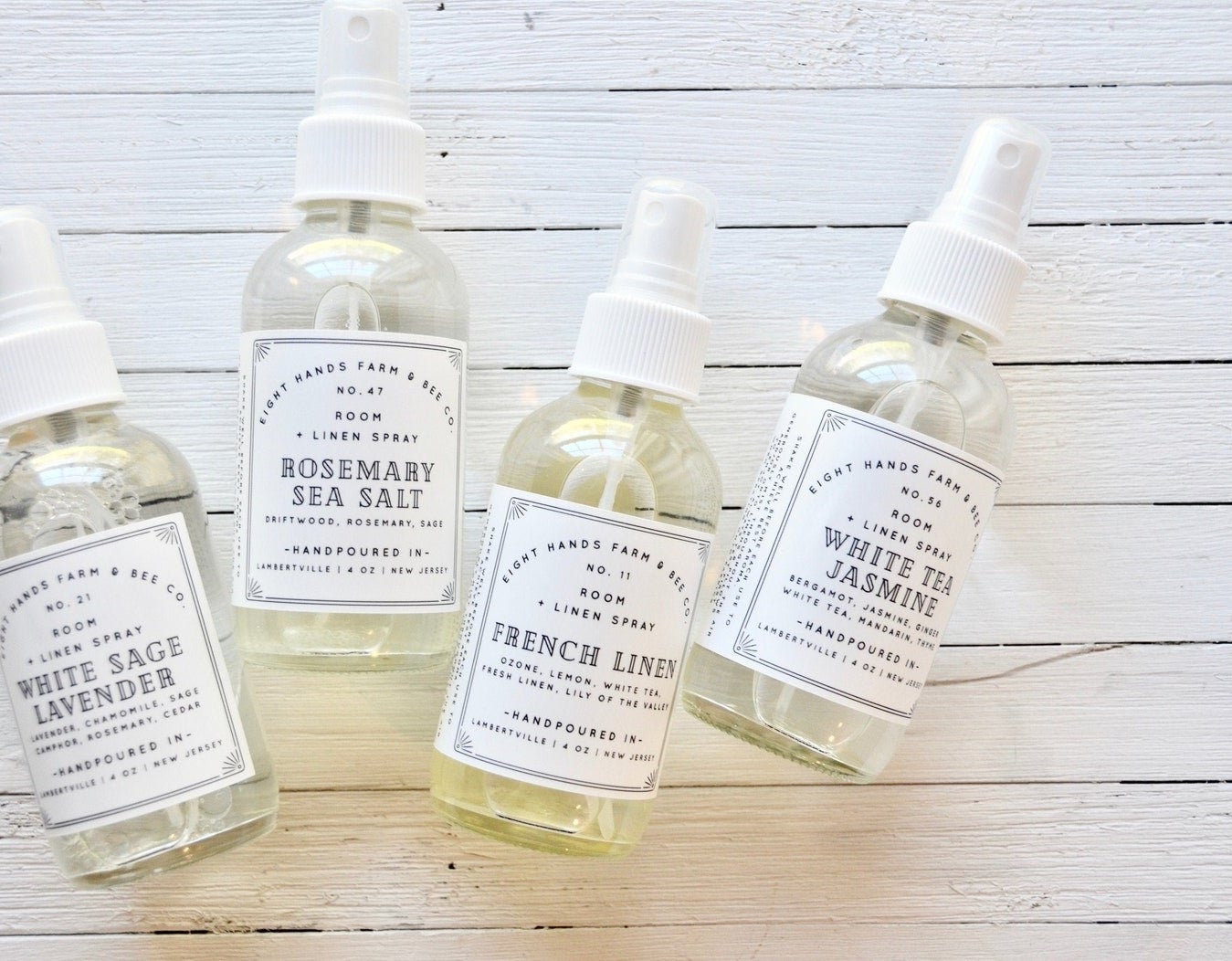 Four bottles of the room and linen spray in different scents
