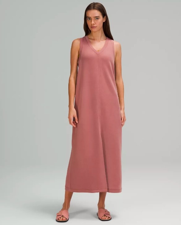 Model wearing the v-neck tank dress in salmon pink