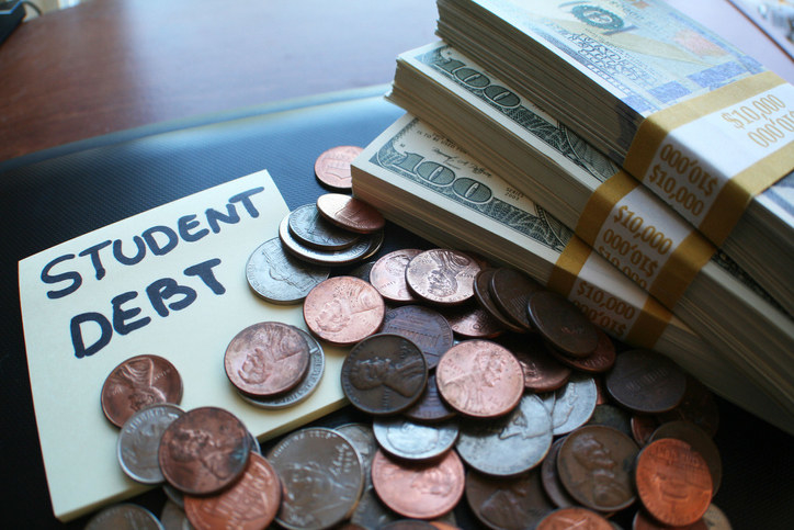 Pile of money and the words &quot;Student debt&quot;