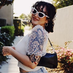 A reviewer wearing the black bag