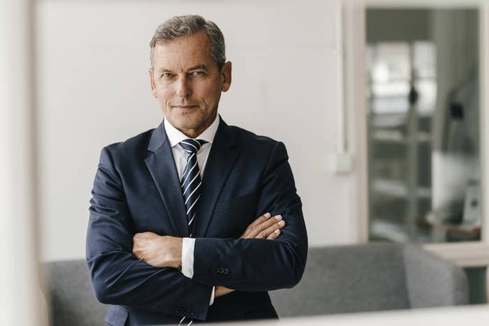 Man in a suit with his arms crossed