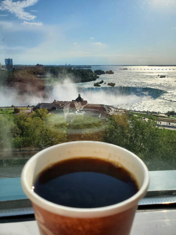 A cup of coffee and the horseshoe falls view from the hotel room.