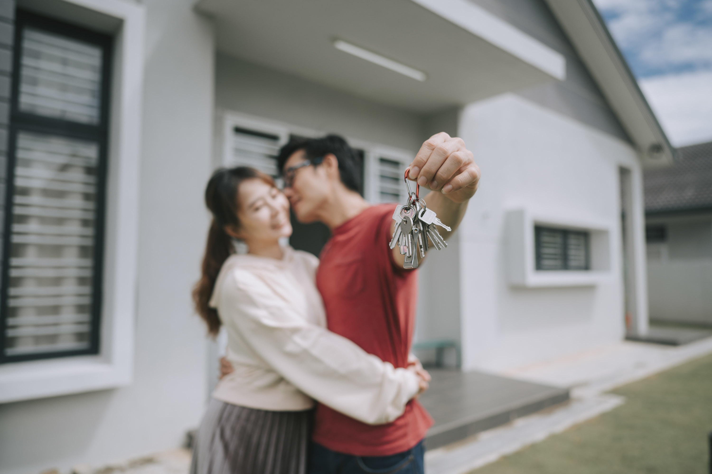 Couple holding the keys to their new home