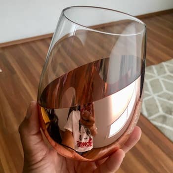 Reviewer holding one of the wine glasses