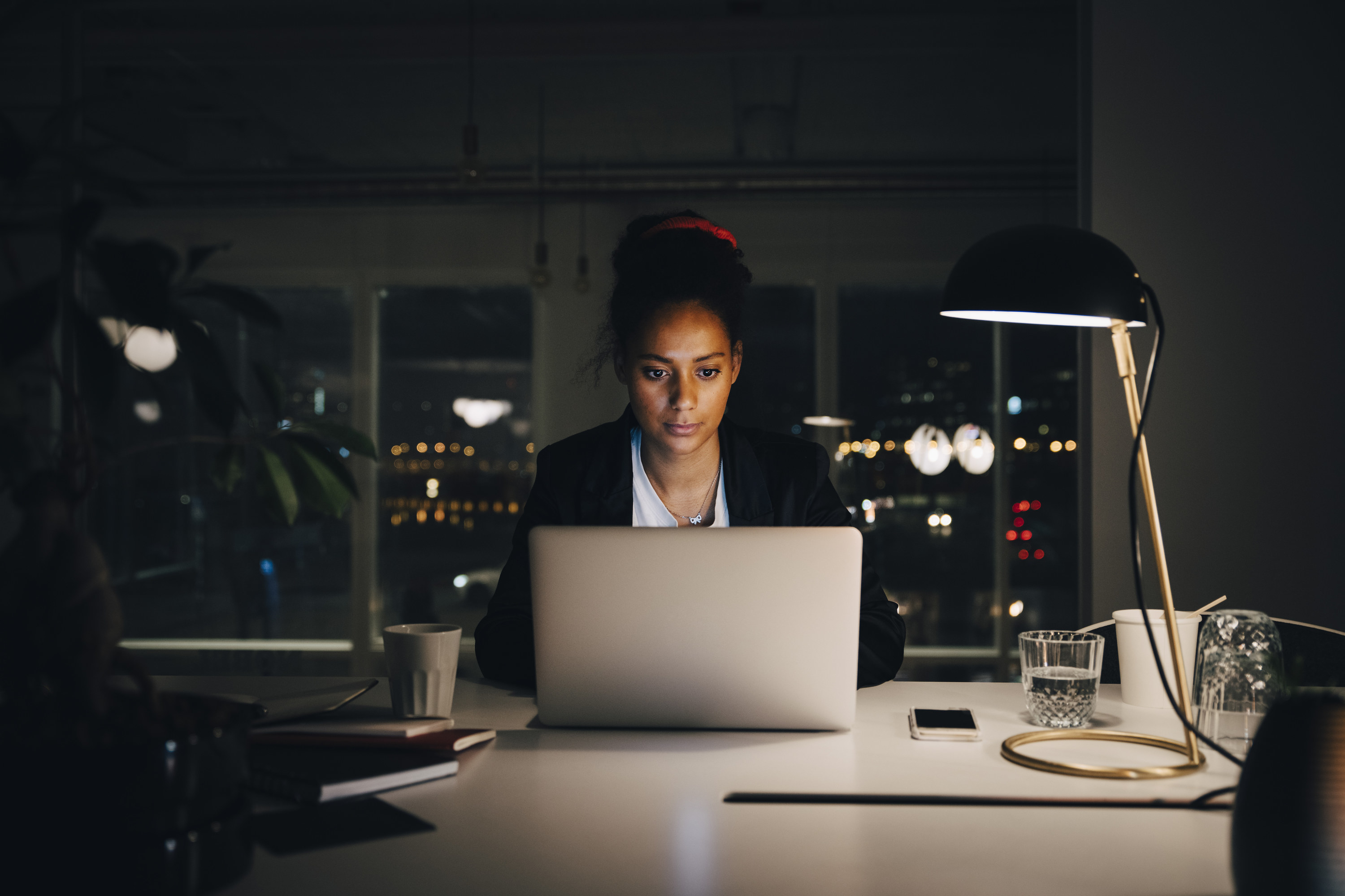 Woman working late at home