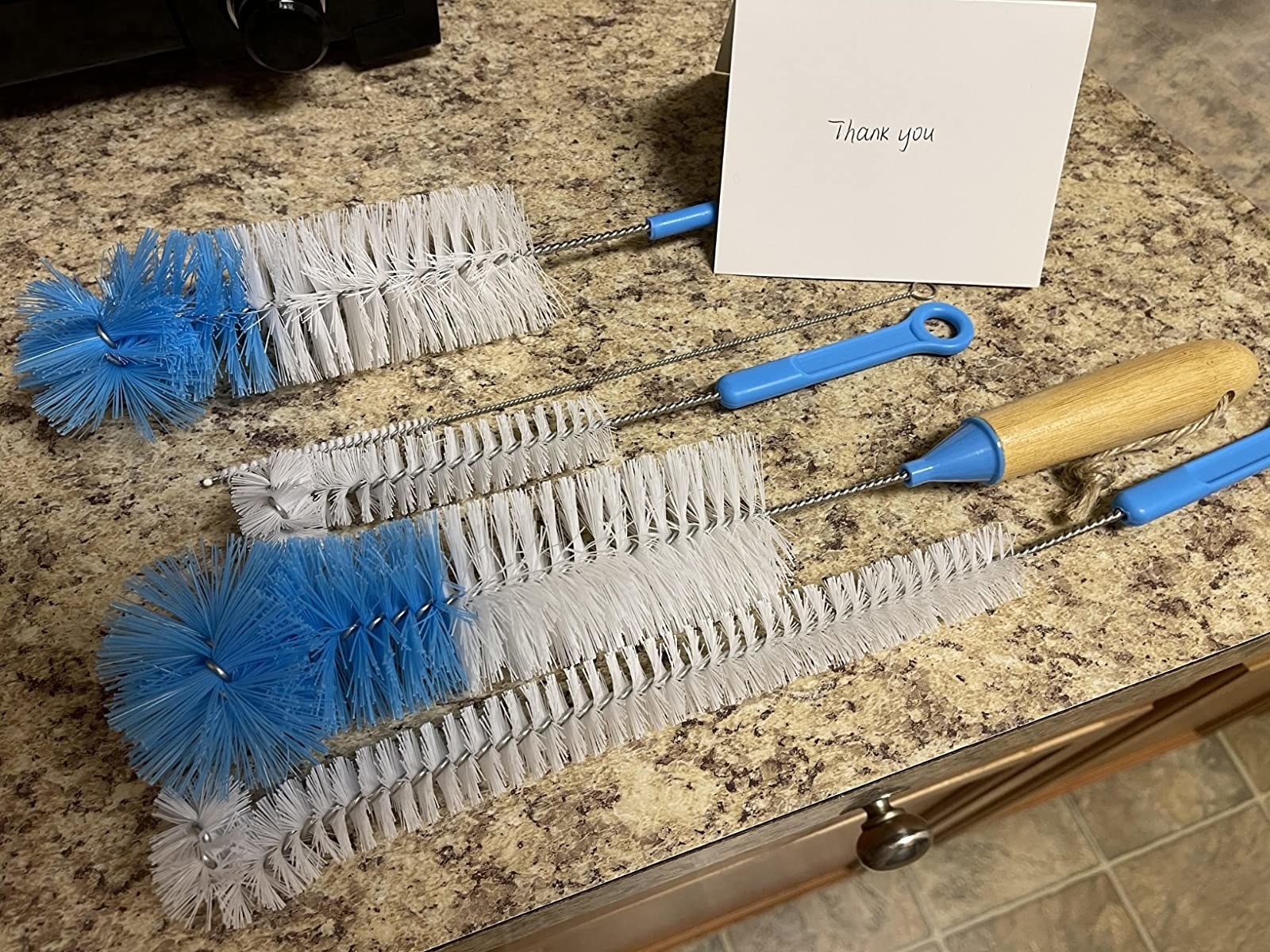 the full set of bottle cleaners with a narrow brush, to big bottle brushes, a small straw, and a straw cleaner