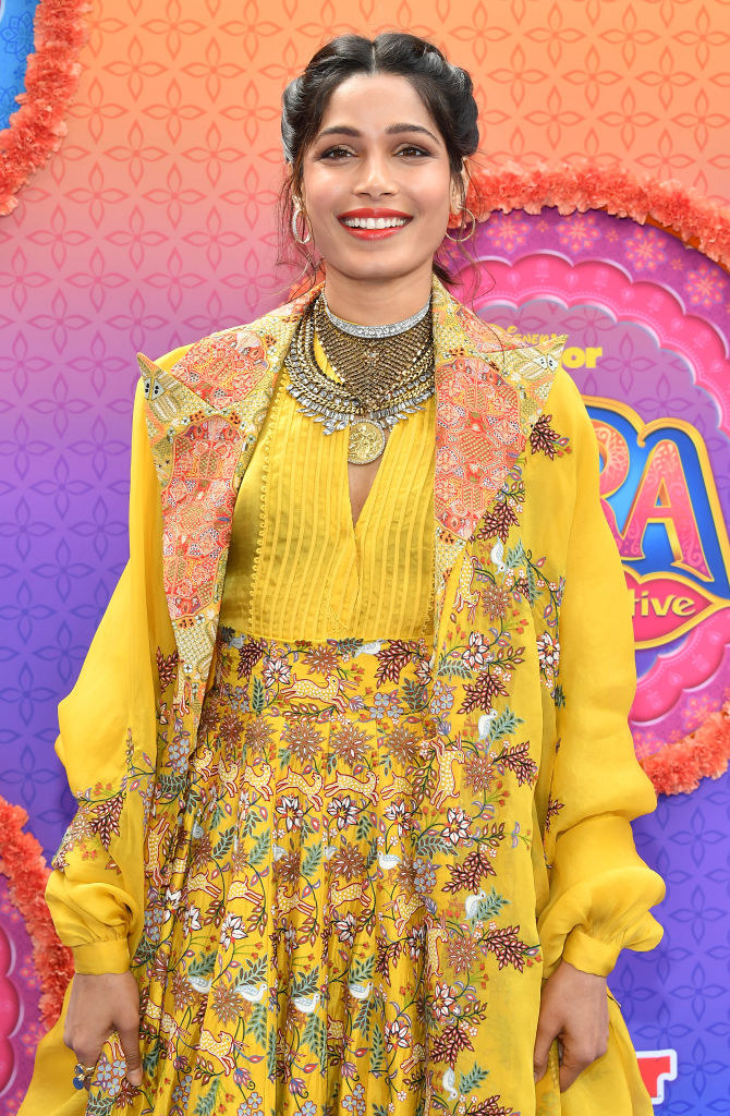 Freida Pinto attends the premiere of Disney Junior&#x27;s &quot;Mira, Royal Detective&quot; in a brightly-colored dress and matching duster