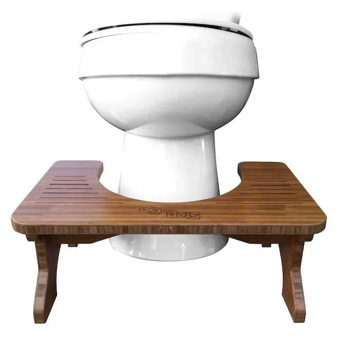 The stool in front of toilet