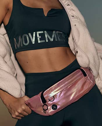 model wearing the pink fanny pack