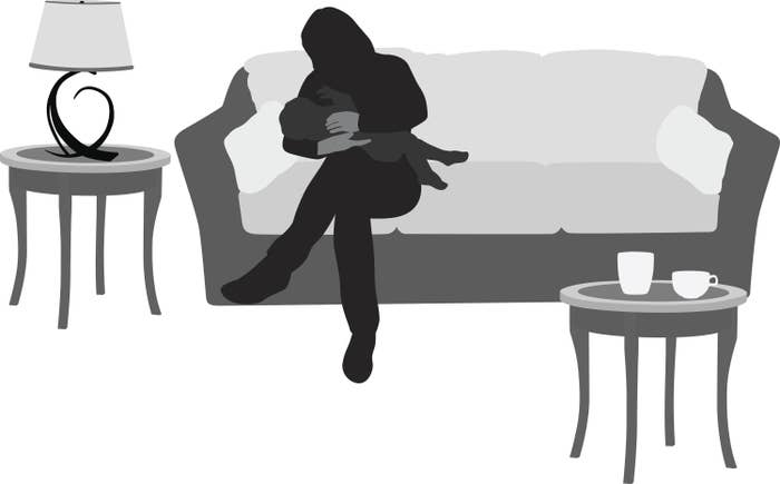 An illustrations of someone attempting to breastfeed as they sit in a living room