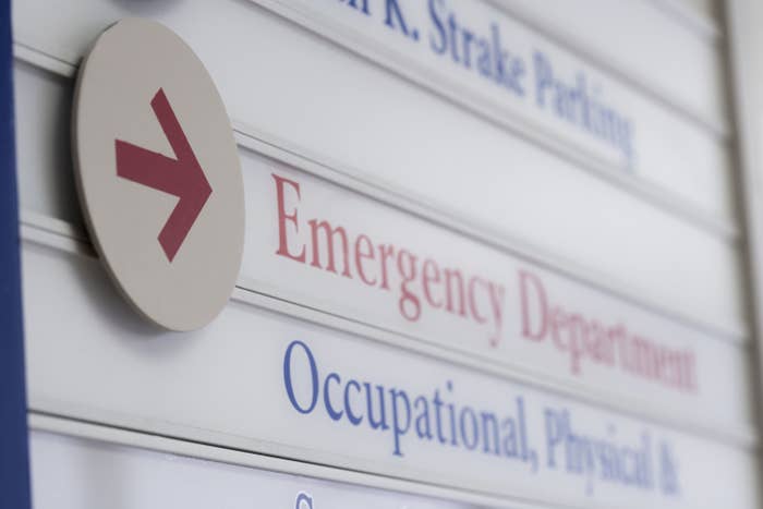 A sign giving directions to the emergency department