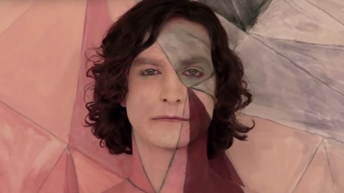 Gotye&#x27;s face with multicolored patches superimposed on it