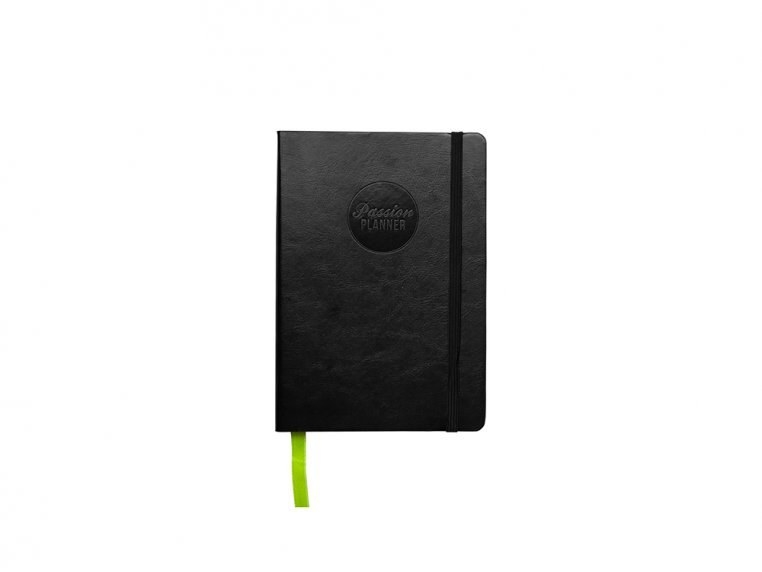 A black notebook with green bookmark