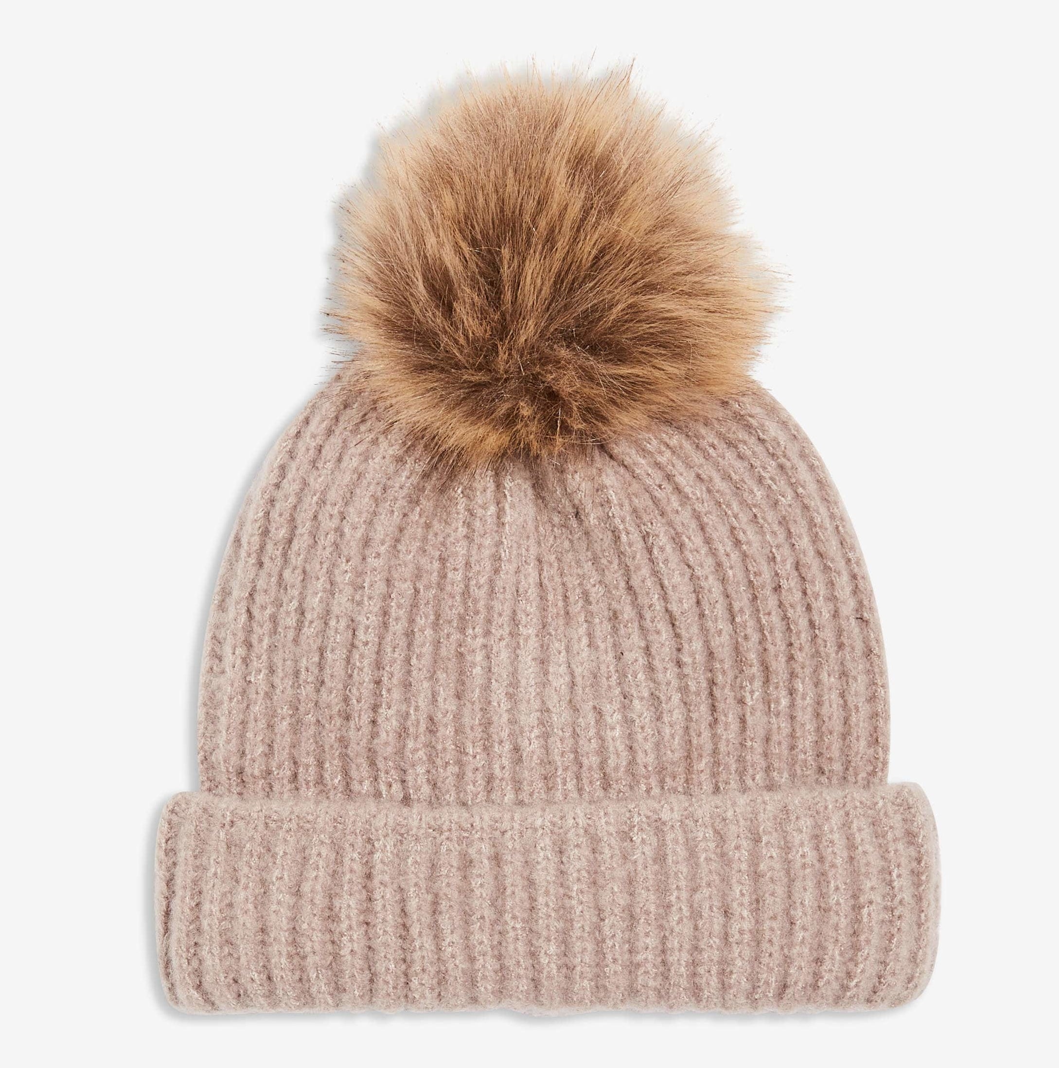 A beanie hat with a furry pom pom on top