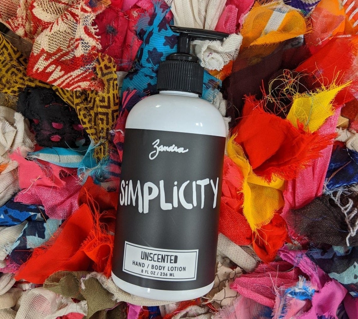 A photo of the Simplicity hand and body lotion on a pile of cloth
