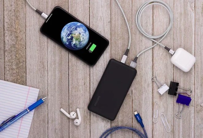 The charging pack charing an iphone and airpods