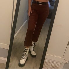 A reviewer posing inย the white combat boots