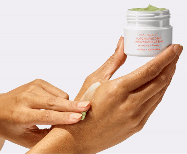 GIF of model rubbing the moisturizer into their hand