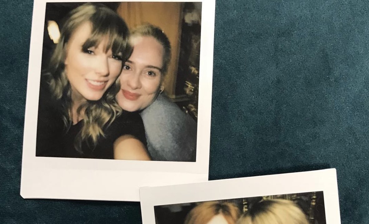 Adele and Taylor swift pose for a polaroid picture