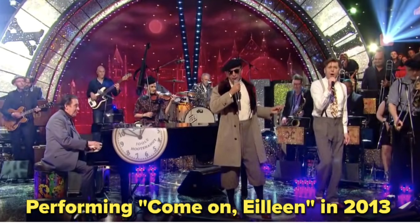 The band performing Come On Eileen in 2013 on TV