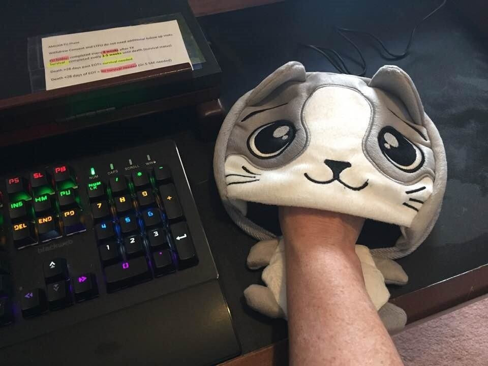 a reviewer photo of someone with their hand inside of the warmer as if using the mouse