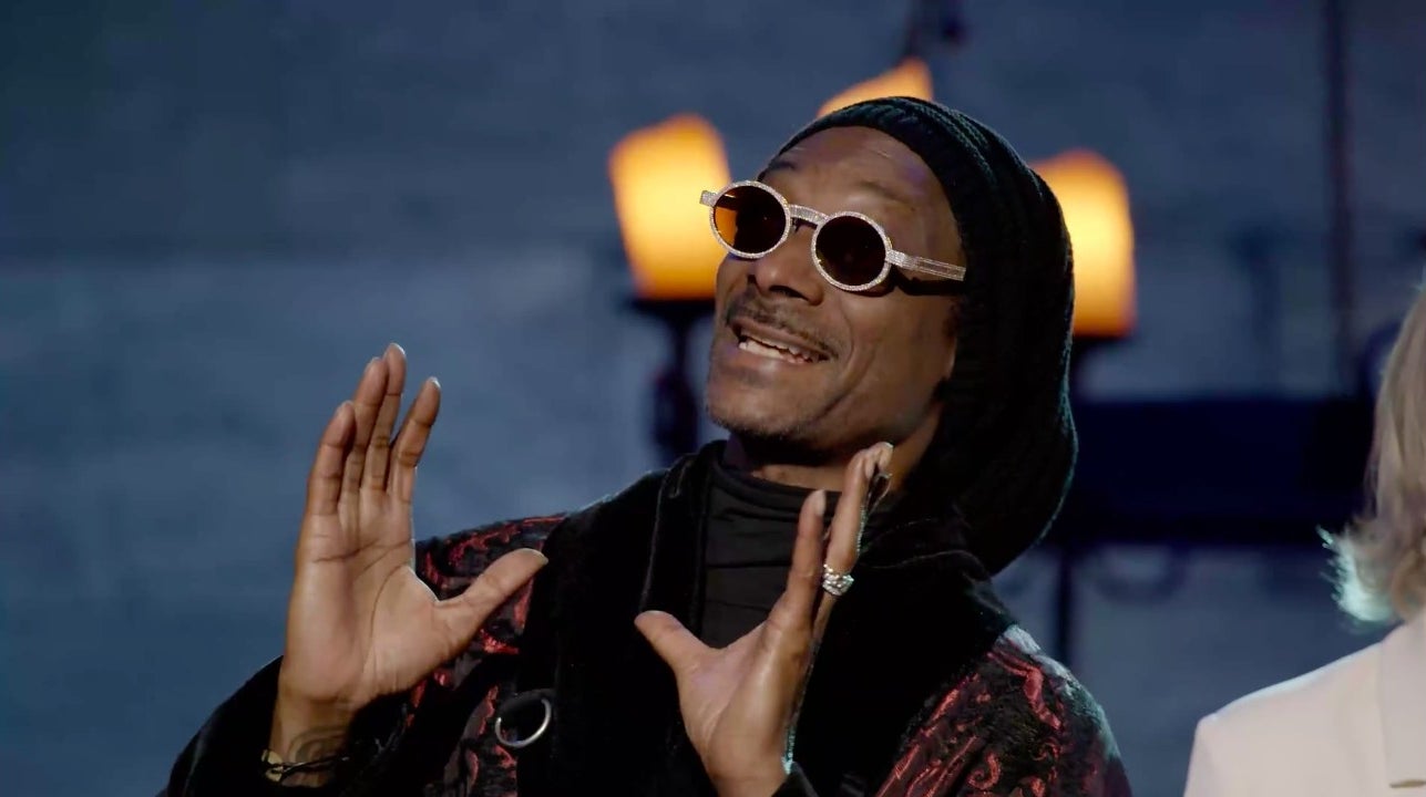 snoop with hands up making a joke