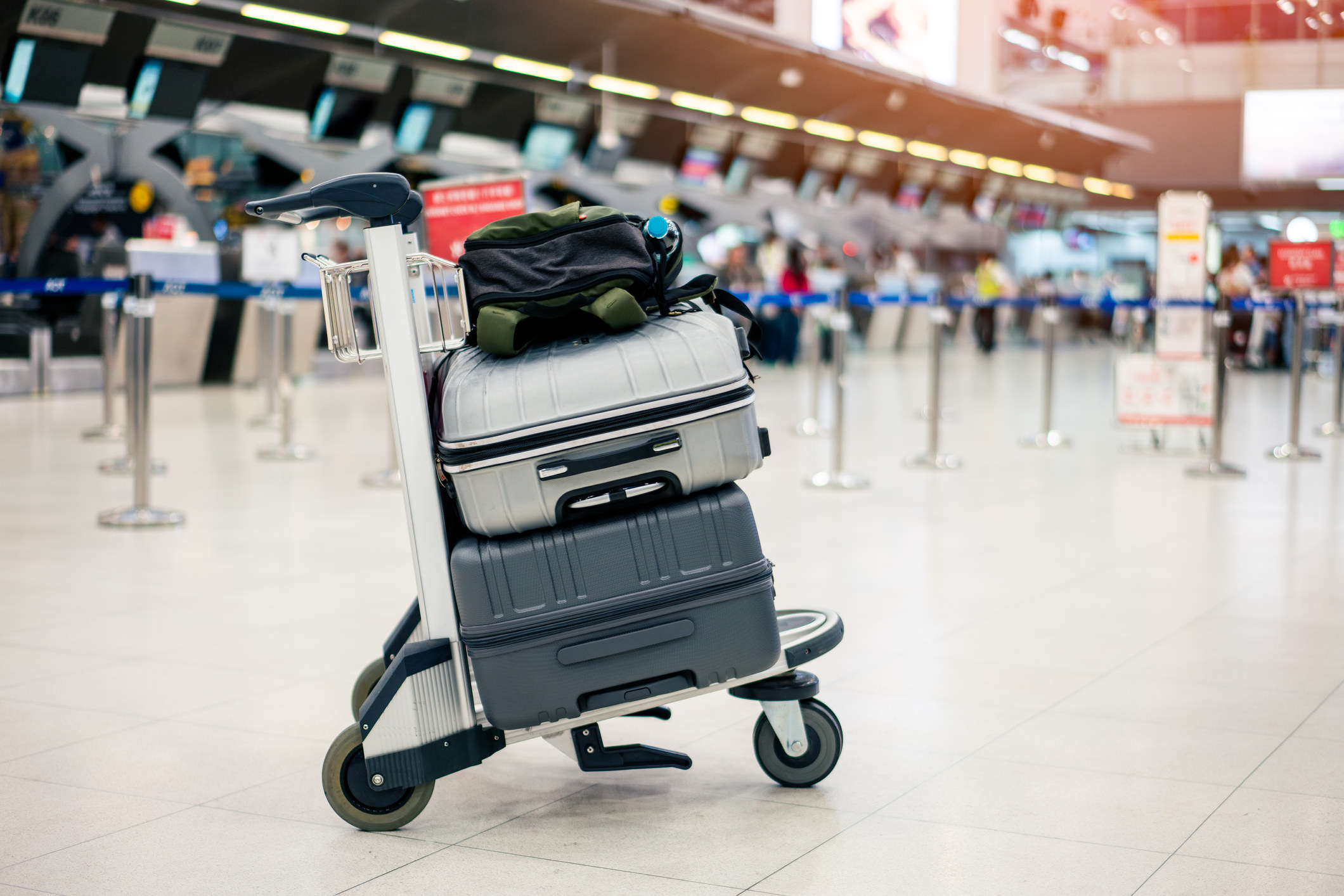 Suitcases piled on top of one another.