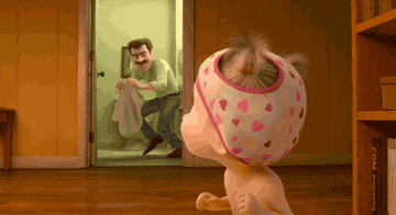 a gif of a toddler running away from their dad who is holding a towel