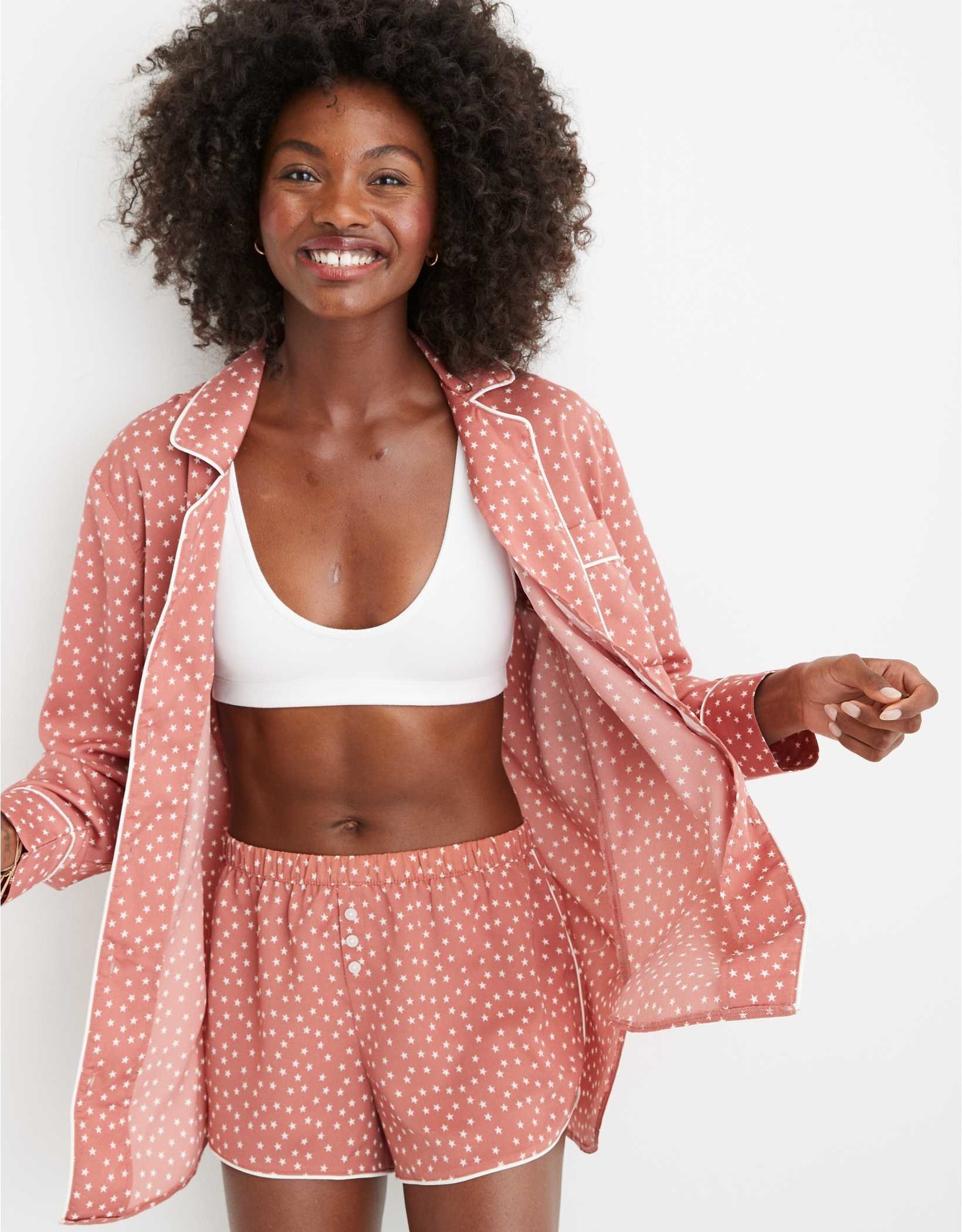 A model wearing the set in Lets Mauve with a sports bra