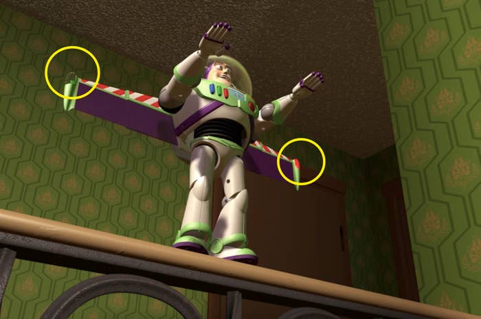 Buzz Lightyear standing on a railing with his arms forward and wings out