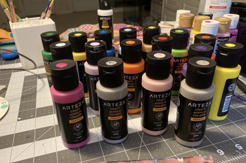 a reviewer photo of assorted acrylic paints